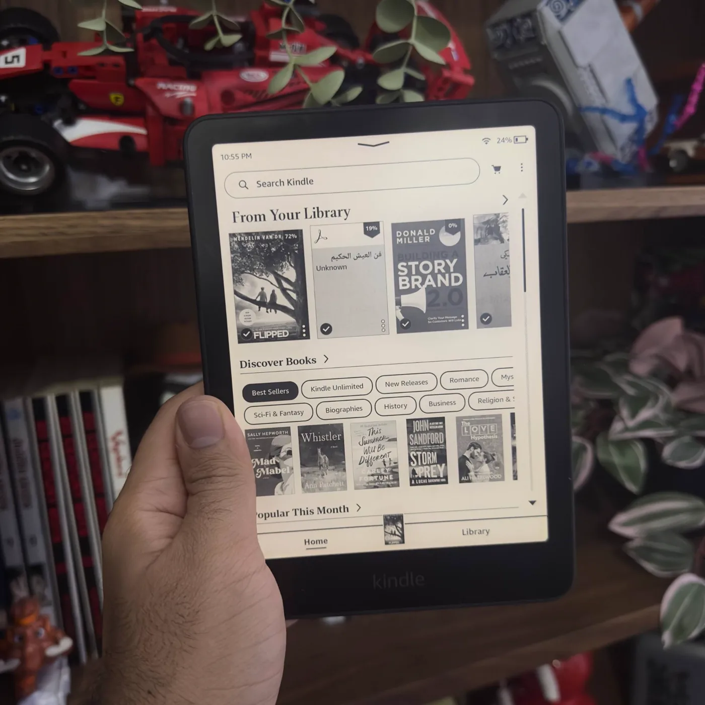 The Kindle home screen showing my library, including the Arabic book The Wisdom of Life.